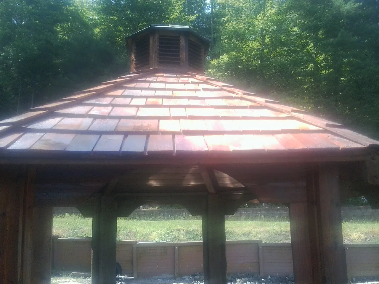 New cedar shake roof and cupola on a lakeside gazebo in Passaic
